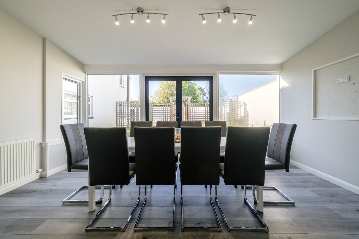 Dining table for ten with doors out to the garden, in a home we look after in Musselburgh